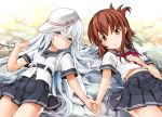  2girls blue_eyes blush brown_eyes brown_hair hammer_and_sickle hat hibiki_(kantai_collection) holding_hands inazuma_(kantai_collection) kantai_collection long_hair lying multiple_girls on_back school_uniform seminoyu serafuku short_hair skirt star verniy_(kantai_collection) water white_hair 