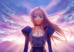  1girl ahoge armor armored_dress blonde_hair clouds fate/stay_night fate_(series) fateline_alpha green_eyes hair_down juliet_sleeves long_hair long_sleeves looking_at_viewer mountain puffy_sleeves saber sky smile solo sunrise 