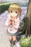  1girl boots brown_eyes brown_hair chocolate chocolate_heart from_above hair_over_one_eye heart holding long_hair looking_at_viewer original outdoors pavement smile solo standing tree twintails valentine yoropa 