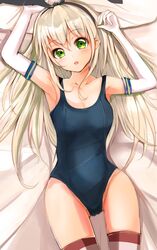  1girl :o arm_up armpits blonde_hair blush collarbone elbow_gloves gloves green_eyes hairband highres kantai_collection long_hair looking_at_viewer lying on_back school_swimsuit shimakaze_(kantai_collection) solo striped striped_legwear swimsuit thigh-highs velia very_long_hair white_gloves 