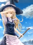  1girl arm_up blonde_hair broom clouds cowboy_shot erio_patrol hat highres kirisame_marisa lens_flare long_hair looking_at_viewer midriff open_mouth shading_eyes sky solo touhou witch_hat yellow_eyes 