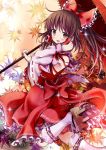  1girl autumn_leaves bow brown_eyes brown_hair detached_sleeves geta givuchoko hair_bow hair_tubes hakurei_reimu long_hair long_sleeves open_mouth oriental_umbrella ponytail sash shirt skirt skirt_set smile solo touhou umbrella wide_sleeves 