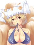  1girl bikini_top blonde_hair bra_in_mouth breasts bust cleavage fox_tail hat hat_with_ears head_tilt highres large_breasts looking_at_viewer multiple_tails nksk solo tail touhou yakumo_ran yellow_eyes 