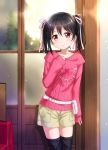  1girl black_hair blush hair_ribbon highres looking_at_viewer love_live!_school_idol_project red_eyes ribbon short_hair shorts sleeves_past_wrists smile solo sweater tucana twintails yazawa_nico 