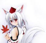  1girl animal_ears autumn_leaves bare_shoulders blush breasts hat highres holding_leaf inubashiri_momiji leaf looking_at_viewer looking_back pom_pom_(clothes) red_eyes short_hair silver_hair simple_background smile solo tail tokin_hat touhou white_background wolf_ears wolf_tail 