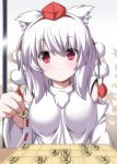  1girl animal_ears board_game close-up detached_sleeves hat highres holding inubashiri_momiji looking_at_viewer nori_tamago pom_pom_(clothes) pov red_eyes short_hair shougi solo tokin_hat touhou white_hair wolf_ears 