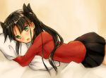  1girl black_hair blush fate/stay_night fate_(series) green_eyes hair_ribbon highres looking_at_viewer lying on_stomach open_mouth pillow pillow_hug pleated_skirt ribbon rupe_paperu skirt solo sweatdrop tohsaka_rin toosaka_rin two_side_up 