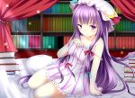  1girl adapted_costume ajiriko alternate_costume bed book bow hair_bow hair_ribbon long_hair looking_at_viewer mob_cap pajamas parted_lips patchouli_knowledge purple_hair ribbon sitting solo touhou violet_eyes 