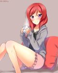  1girl blush cup dated highres hoodie looking_at_viewer love_live!_school_idol_project mug nishikino_maki pillow redhead short_hair shorts sitting smile solo steam thighs violet_eyes yu-ta 