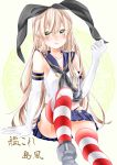  1girl absurdres anchor blonde_hair blue_skirt blush elbow_gloves gloves green_eyes hairband highres kantai_collection long_hair looking_at_viewer shimakaze_(kantai_collection) sitting skirt solo striped striped_legwear thigh-highs white_gloves 