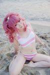  anya_alstreim arm_support barefoot beach code_geass cosplay destiny_doll flat_chest head_tilt lipstick navel outdoors photo pink_hair ponytail red_eyes ryuuhime sitting smile solo striped striped_bikini tankini water 