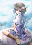  1girl akino_irori blue_hair blue_skirt boots bow clouds food frilled_skirt frills fruit hat highres hinanawi_tenshi long_hair looking_at_viewer peach red_eyes shirt shoe_soles short_sleeves sitting skirt sky smile solo touhou wariza 