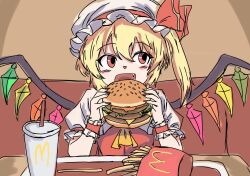  1girl blonde_hair burger crystal_wings cup disposable_cup eating fang flandre_scarlet food french_fries hat hat_ribbon highres holding holding_burger holding_food indoors kametoyou light_blush looking_to_the_side mcdonald's medium_hair mob_cap one_side_up open_mouth red_eyes red_ribbon ribbon smile solo touhou wings 