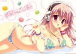  1girl absurdres bikini bracelet breasts cleavage green_bikini headphones highres huge_filesize jewelry large_breasts long_hair lying macaron necklace nitroplus on_stomach pink_eyes pink_hair ryouka_(suzuya) side-tie_bikini strap_pull string_bikini super_sonico swimsuit wristband 