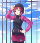  1girl adjusting_clothes adjusting_hat beanie clouds cowboy_shot hand_on_hip hat highres jacket long_sleeves looking_at_viewer love_live!_school_idol_project nishikino_maki open_mouth outdoors pants redhead short_hair sky sleeveless smile solo standing star sweater violet_eyes wawawa_(hisuterisisusa) 
