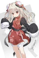  1girl akaneko016 alternate_costume bell blonde_hair blush_stickers bun_cover chinese_clothes commentary_request double_bun fate/kaleid_liner_prisma_illya fate_(series) feet_out_of_frame hair_bun highres illyasviel_von_einzbern long_hair looking_at_viewer ofuda red_eyes shorts signature simple_background sleeves_past_fingers sleeves_past_wrists smile solo white_shorts 