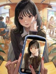  1boy 1other 3girls absurdres black_hair blue_nails blurry blurry_foreground blush brown_eyes cellphone chair commentary desk fisheye hand_up hanging_light highres holding holding_phone indoors jewelry looking_at_viewer multiple_girls nail_polish open_mouth original phone plant potted_plant pov pov_across_table pov_hands red_nails ring taking_picture utaka_(anyoanyot) 