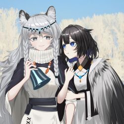  2girls absurdres animal_ear_fluff animal_ears arknights arm_hug bell black_cape black_hair blue_eyes braid bright_pupils cape chinese_commentary closed_mouth colored_inner_hair commentary_request dress grey_cape grey_eyes grey_hair hair_between_eyes highres holding holding_bell jewelry kjera_(arknights) long_hair looking_at_another multicolored_hair multiple_girls necklace pramanix_(arknights) short_hair side_braids taka_yoha twin_braids two-sided_cape two-sided_fabric white_dress white_pupils yuri 