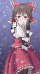  1girl blush bow brown_hair cold detached_sleeves embellished_costume hair_bow hair_tubes hakurei_reimu highres long_sleeves looking_at_viewer red_eyes scarf scarf_over_mouth shefu shirt skirt skirt_set snowing solo touhou trembling wide_sleeves 