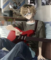  1boy bedroom black_eyes brown_hair brown_shirt closed_mouth commentary ear_piercing earrings feet_out_of_frame grey_pants guitar hair_between_eyes headphones highres holding holding_plectrum indoors instrument jewelry looking_at_viewer male_focus messy_hair multicolored_hair on_floor original pants piercing plectrum roots_(hair) sanpaku shirt short_hair sini_user sitting solo untranslatable_commentary unworn_headphones 