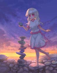  1girl absurdres barefoot blush chinese_commentary closed_mouth commentary_request ebisu_eika frilled_shirt_collar frilled_skirt frills full_body grey_hair highres holding holding_rock long_earlobes outdoors puffy_short_sleeves puffy_sleeves red_eyes rock rock_balancing shirt short_sleeves skirt smile solo stack stacking toes toorooo touhou white_shirt white_skirt 