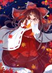  1girl absurdres ascot autumn_leaves blurry bow brown_eyes brown_hair chiwai crying depth_of_field detached_sleeves from_above hair_bow hair_tubes hakurei_reimu highres long_hair long_skirt looking_at_viewer partially_submerged reaching_out red_skirt ribbon-trimmed_sleeves ribbon_trim sad skirt sleeveless solo teardrop tears touhou water wide_sleeves 
