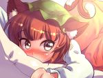  1girl animal_ears blush brown_eyes brown_hair cat_ears cat_tail chen commentary covering_mouth dress ear_piercing jewelry long_sleeves looking_at_viewer lying mob_cap multiple_tails on_stomach piercing pillow red_dress single_earring solo tail touhou volcano_(artist) 