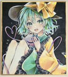  1girl :d black_hat blue_nails blush bow collared_shirt commentary_request disembodied_linked_eye eyeball frilled_shirt_collar frilled_skirt frilled_sleeves frills furawast green_eyes green_hair green_skirt hat hat_bow heart heart_of_string highres komeiji_koishi long_sleeves looking_at_viewer medium_hair open_mouth photo_(medium) shikishi shirt skirt smile solo touhou traditional_media wide_sleeves yellow_bow yellow_shirt 