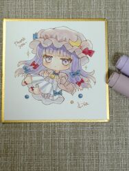  1girl absurdres art_tools_in_frame blue_bow blue_bowtie bow bowtie capelet chibi chibi_only commentary_request crescent crescent_hat_ornament dress english_text full_body hair_bow hat hat_ornament highres kisarush long_hair mob_cap multiple_hair_bows patchouli_knowledge photo_(medium) pink_capelet pink_dress pink_hat purple_hair red_bow solo striped_clothes striped_dress thank_you touhou vertical-striped_clothes vertical-striped_dress violet_eyes 