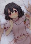  1girl animal_ears black_hair blush carrot_necklace inaba_tewi looking_at_viewer lying navel nnyara on_back pillow rabbit_ears red_eyes ribbon-trimmed_clothes ribbon-trimmed_sleeves ribbon_trim short_hair short_sleeves solo_focus sweat touhou 