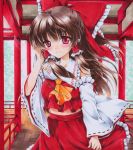  1girl architecture ascot blush bow brown_hair detached_sleeves east_asian_architecture hair_bow hair_tubes hakurei_reimu long_hair midriff red_eyes ren_(endscape20) smile solo touhou traditional_media 