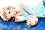  1girl bare_shoulders blonde_hair blue_eyes braid bridal_gauntlets detached_sleeves elsa_(frozen) esther eyelashes foreshortening frozen_(disney) hair_ornament lips long_hair looking_at_viewer lying nose on_side single_braid snowflake_hair_ornament snowflakes solo sparkle_print 