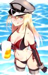  1girl :q absurdres adapted_costume alcohol beer bikini bismarck_(kantai_collection) blonde_hair blue_eyes breasts cleavage don_(don_0608) feet_in_water front-tie_top gloves hat highres kantai_collection long_hair military military_uniform peaked_cap shiny shiny_skin smile soaking_feet solo swimsuit thigh-highs tongue tongue_out uniform wading water 