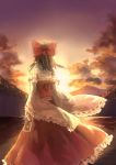  1girl absurdres bow brown_hair clouds detached_sleeves hair_bow hair_tubes hakurei_reimu hankon highres landscape long_sleeves mountain ribbon-trimmed_sleeves ribbon_trim scenery shirt skirt skirt_set sky solo spell_card star_(sky) sunset touhou wide_sleeves 