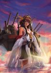  1girl absurdres ahoge bare_shoulders boots brown_hair cannon cowboy_shot double_bun hairband highres kantai_collection kongou_(kantai_collection) long_hair looking_at_viewer mecha_musume nontraditional_miko skirt solo sun sunset thigh-highs thigh_boots turret wading 