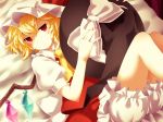  1girl ascot bed bed_sheet blonde_hair bloomers dress flandre_scarlet hat holding holding_hat jitome looking_at_viewer lying on_back puffy_short_sleeves puffy_sleeves red_dress red_eyes short_hair short_sleeves side_ponytail solo touhou underwear witch_hat yuka_yukiusa 
