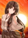  1girl brown_hair brown_skirt dusk hair_ribbon japanese_clothes kamelie kantai_collection long_hair looking_at_viewer low-tied_long_hair ocean pleated_skirt ribbon shouhou_(kantai_collection) skirt smile solo sunset upper_body 