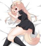  1girl black_legwear black_ribbon black_serafuku black_skirt blonde_hair breasts dog_tail fang hair_flaps hair_ornament hair_ribbon hairclip highres kantai_collection long_hair lying on_side pantyhose pleated_skirt remodel_(kantai_collection) ribbon school_uniform serafuku short_sleeves skirt solo tail yuudachi_(kantai_collection) 