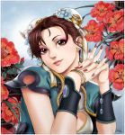  1girl absurdres alternate_costume border bracer brown_hair bun_cover china_dress chinese_clothes chun-li cleavage_cutout double_bun eyelashes eyeshadow flower gtolin_chang highres jewelry lips lipstick makeup nose ring short_hair solo street_fighter wedding_ring 