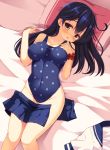  1girl ahoge black_hair blush breasts brown_eyes covered_navel hand_on_own_chest highleg highleg_swimsuit highres impossible_clothes impossible_swimsuit kantai_collection long_hair looking_at_viewer lying on_back on_bed one-piece_swimsuit open_clothes open_skirt pillow polka_dot polka_dot_swimsuit skirt skirt_removed solo swimsuit ushio_(kantai_collection) wrist_scrunchie yuzu_modoki 
