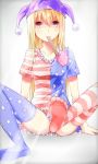  1girl american_flag_legwear american_flag_shirt blonde_hair blush clownpiece convenient_censoring convenient_leg gradient gradient_background hat he2kin jester_cap looking_at_viewer mouth_hold print_legwear red_eyes short_sleeves sitting smile solo star striped thigh-highs touhou 