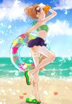  1girl beach blush brown_hair clouds crab flip-flops goggles highres kantai_collection oboro_(kantai_collection) ocean sandals sky solo spray standing_on_one_leg starfish tan tanline water 