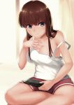  1girl blue_eyes breasts brown_hair cleavage handheld_game_console highres indian_style original playstation_vita shorts sitting solo tank_top 