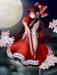  1girl ascot ball bell bow brown_hair cherry_blossoms detached_sleeves embellished_costume flower full_body full_moon hair_bow hair_flower hair_ornament hair_tubes hakurei_reimu highres holding jingle_bell lace-trimmed_dress long_hair moon night night_sky outdoors seven_zhu_bing_yi sitting sky solo touhou 