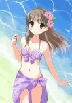  1girl 2015 atelier_(series) atelier_totori beach bikini blush bow brown_eyes brown_hair dated flower hair_flower hair_ornament long_hair minidraco purple_bikini purple_bow sarong signature smile solo swimsuit totooria_helmold water 