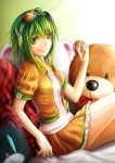  &gt;:) goggles green_eyes green_hair gumi headphones highres ipod_shuffle jacket jurrig looking_at_viewer open_clothes open_jacket orange_skirt shirt short_sleeves sitting skirt smile stuffed_animal stuffed_toy vocaloid white_shirt 