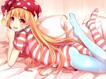  1girl american_flag_legwear american_flag_shirt ass asymmetrical_legwear blonde_hair clownpiece hat highres jester_cap long_hair lying on_bed on_stomach open_mouth pantyhose pillow qunqing red_eyes smile solo touhou 