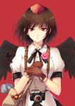  1girl \||/ bag bird_wings black_hair black_wings brown_gloves cibo_(killy) collared_shirt feathered_wings flower gloves hat holding holding_flower looking_at_viewer newspaper puffy_short_sleeves puffy_sleeves red_background red_eyes shameimaru_aya shirt short_hair short_sleeves shoulder_bag simple_background solo tokin_hat touhou upper_body white_shirt wings 