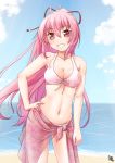  1girl ayama_yuiya beach bikini grin komine_shiro long_hair ouka_(komine_shiro) pink_hair red_eyes sarong smile standing swimsuit 