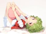  1girl blush bottomless flan_(harry_mackenzie) from_behind full_body green_hair kazami_yuuka knees_up looking_at_viewer looking_back lying messy_hair no_shoes on_back open_clothes open_vest parted_lips pillow plaid red_eyes shirt short_hair short_sleeves socks solo tiptoes touhou vest white_background white_legwear white_shirt younger 